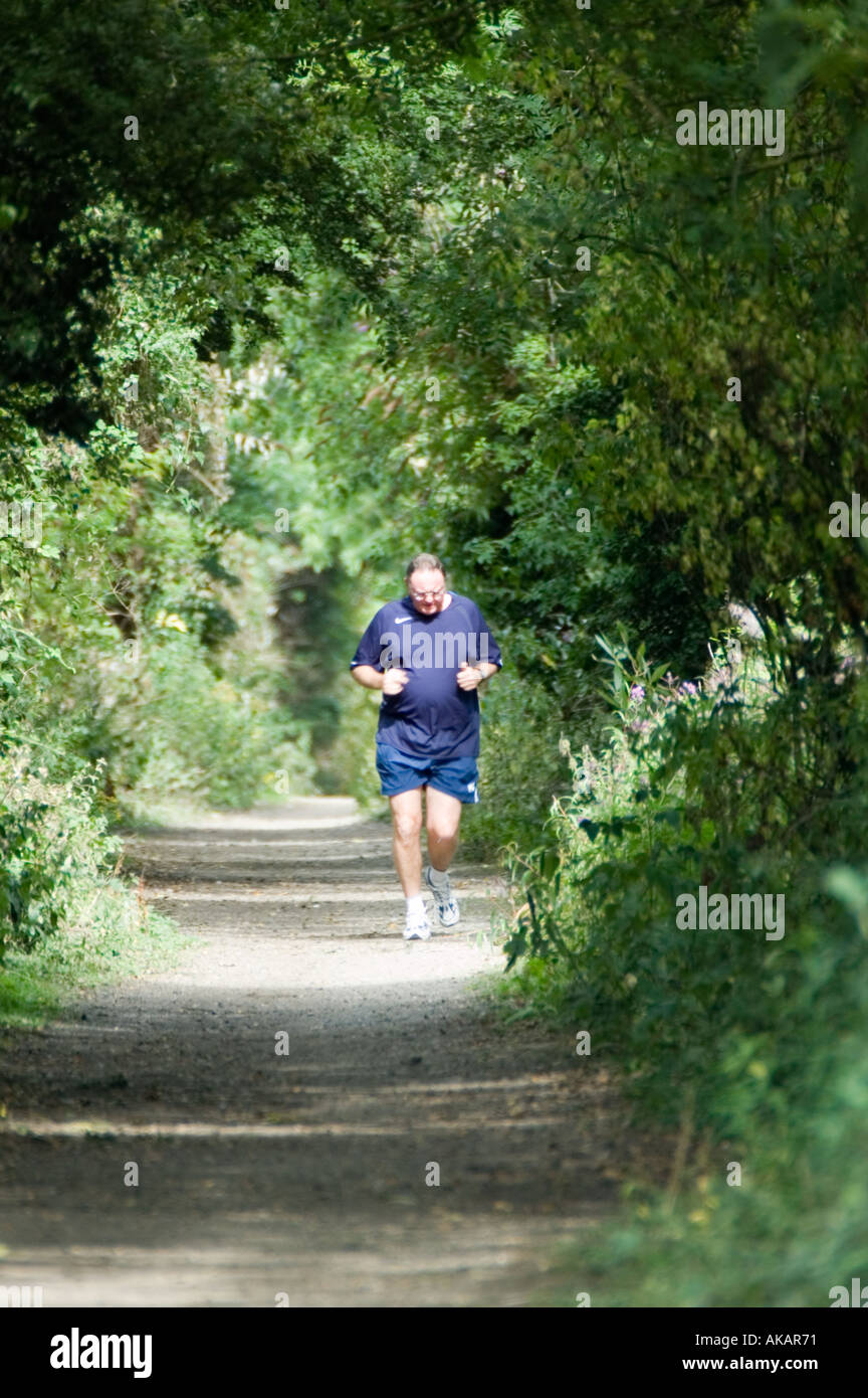 Jogging on Country footpath Stock Photo