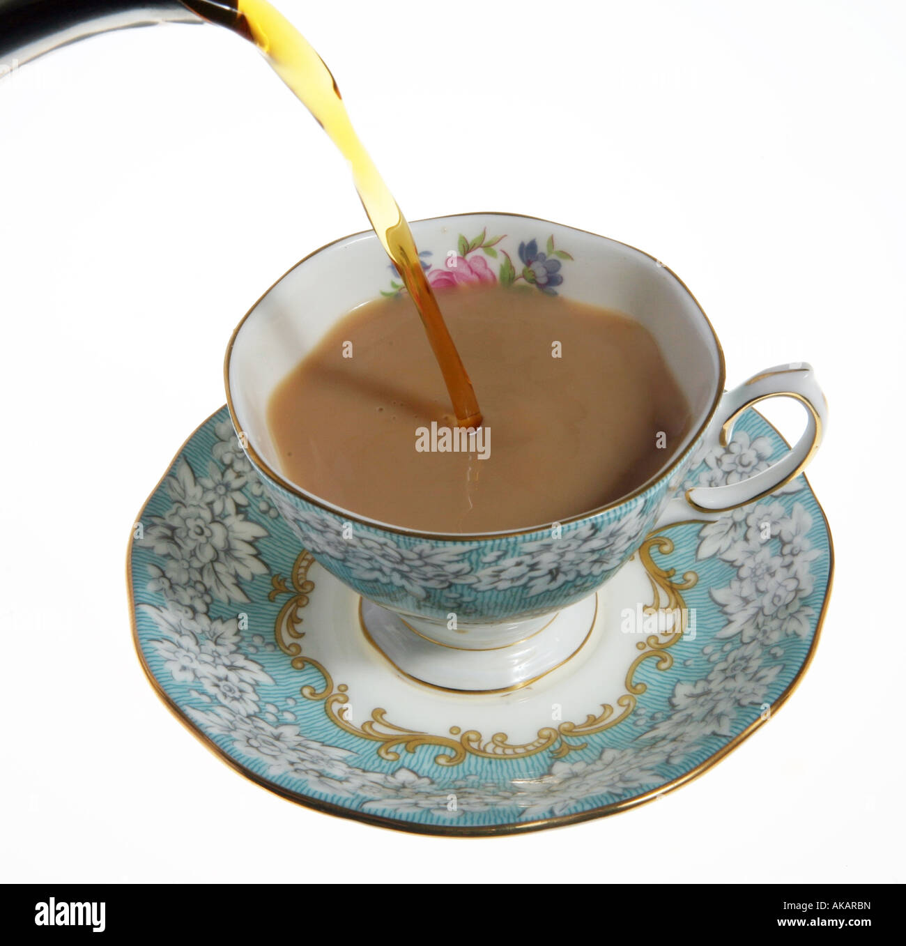 A nice cup of tea being poured into a fine bone china cup Stock Photo ...