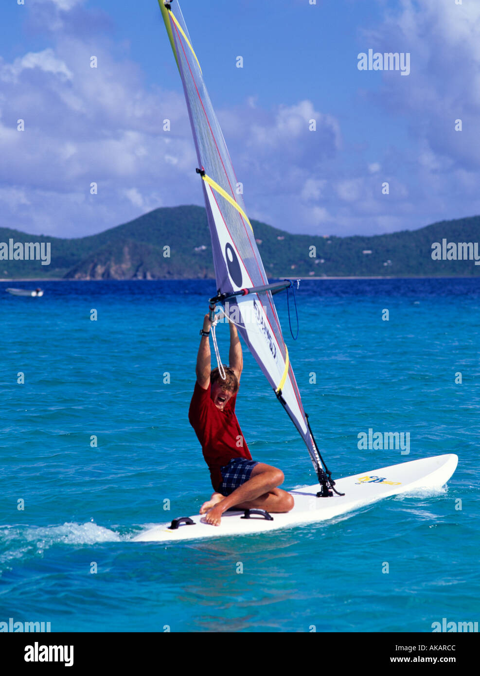 Windsurfing in tropical sea of White Bay Jost van Dyke British Virgin Islands Caribbean Stock Photo