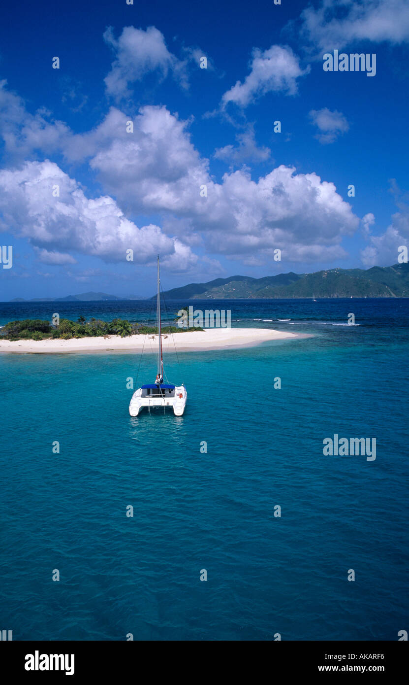 Catamaran anchored crystal clear blue water Sandy Spit British Virgin