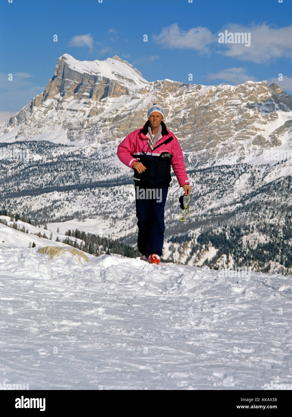 Person in ski wear walking in snow in the Dolomites Italy. On the Sella Ronda with snowy landscape behind Stock Photo