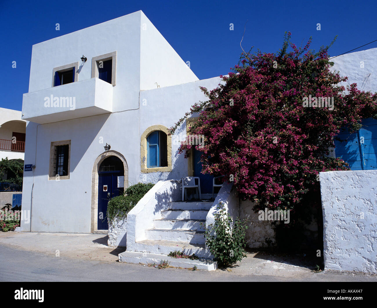 White building with tree Greece Stock Photo