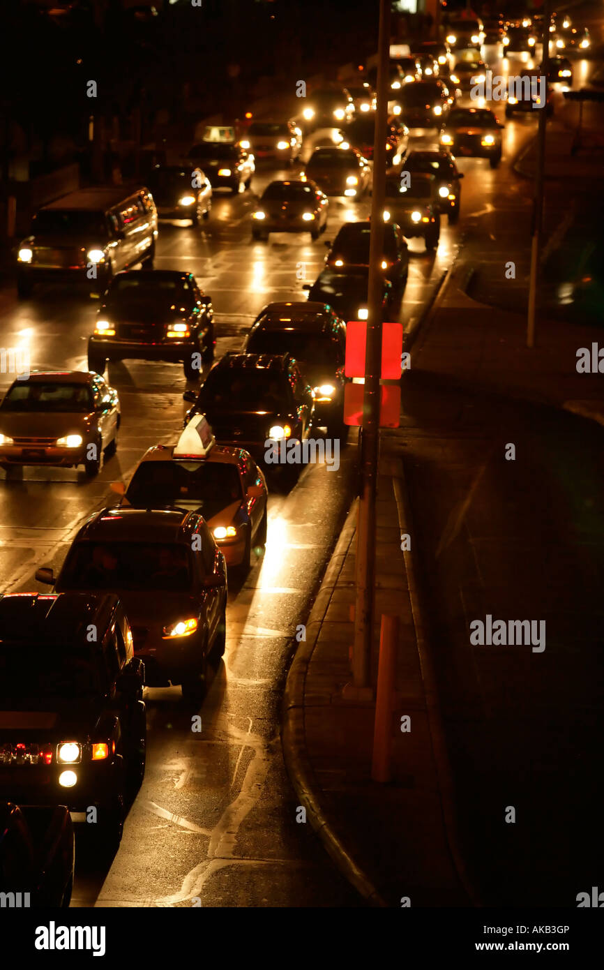 Vehicle Traffic on a rainy night. Stock Photo