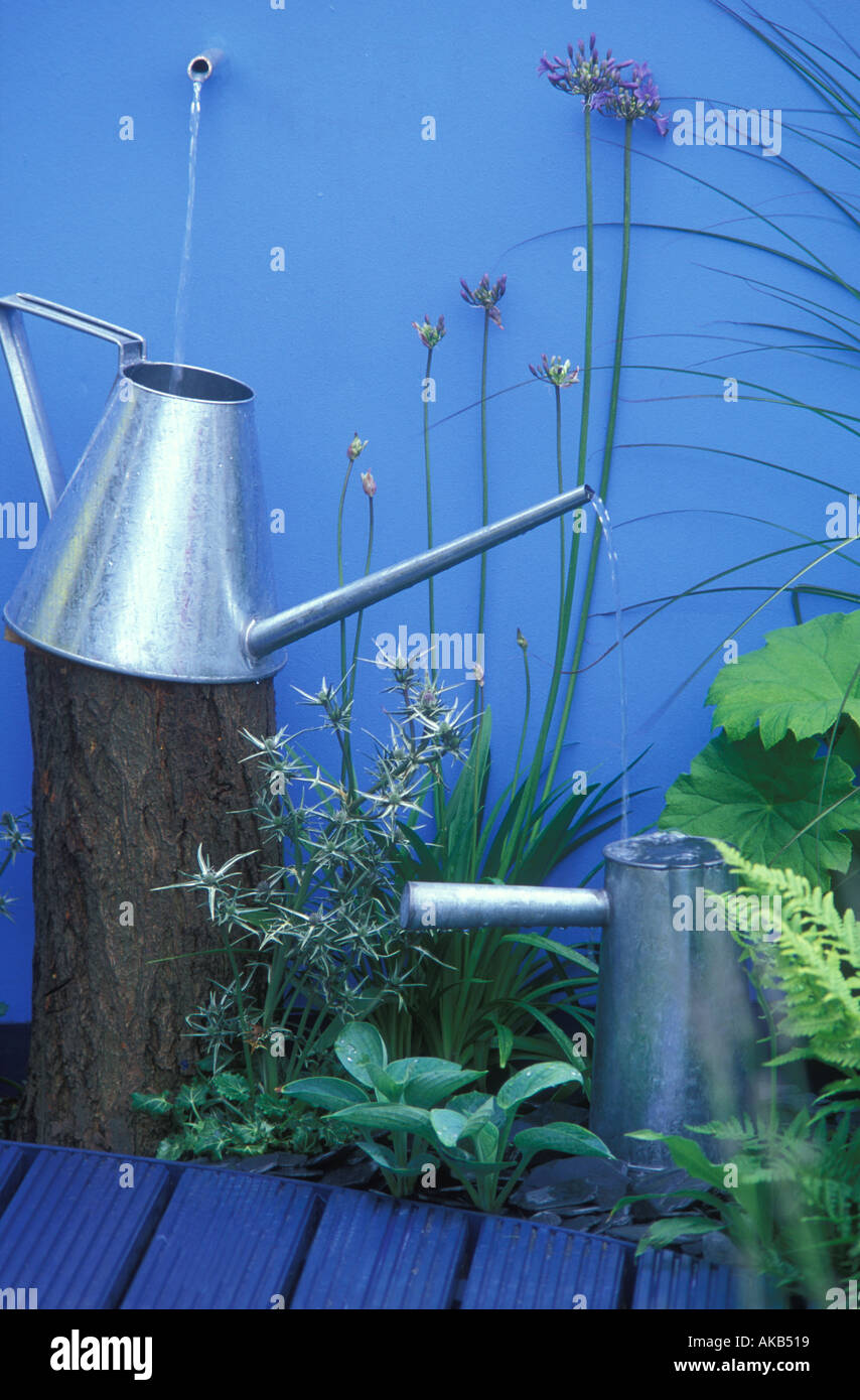 Watering can water feature Stock Photo Alamy