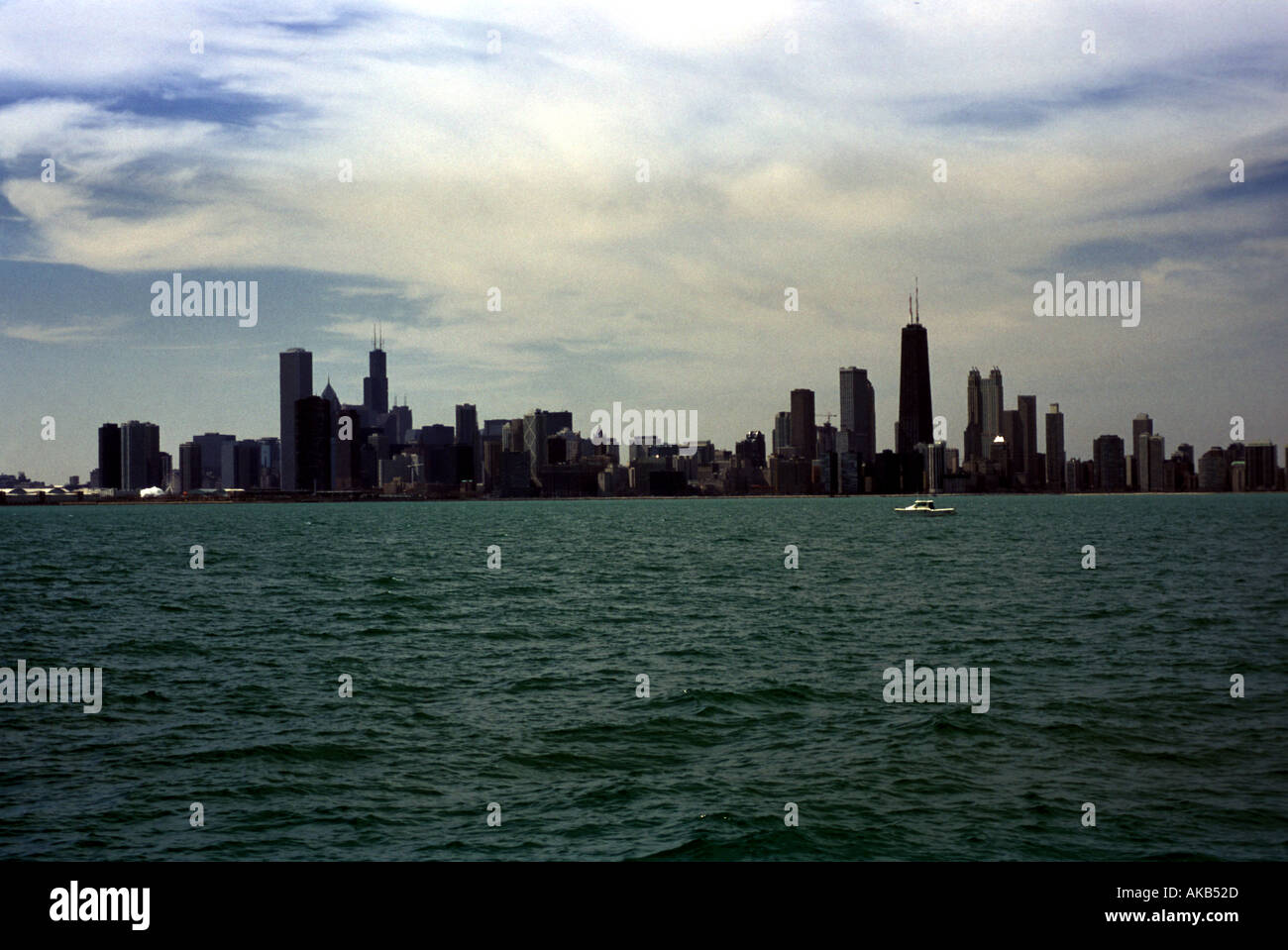 Chicago skyline is silhouetted with Lake Michigan in foreground Stock ...