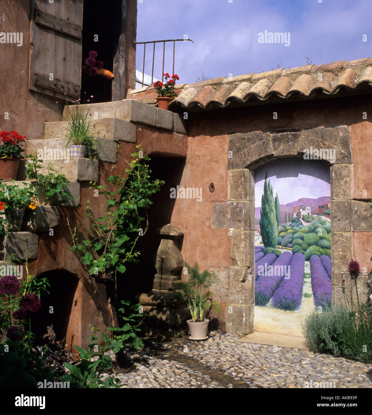 Chelsea FS 1997 design Fiona Lawrenson Provencal garden patio with trompe l'oeil painting Stock Photo