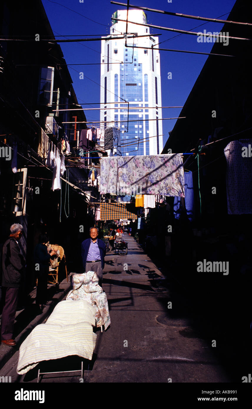 Laundry drying on bamboo poles at the old district of Shanghai city China Stock Photo