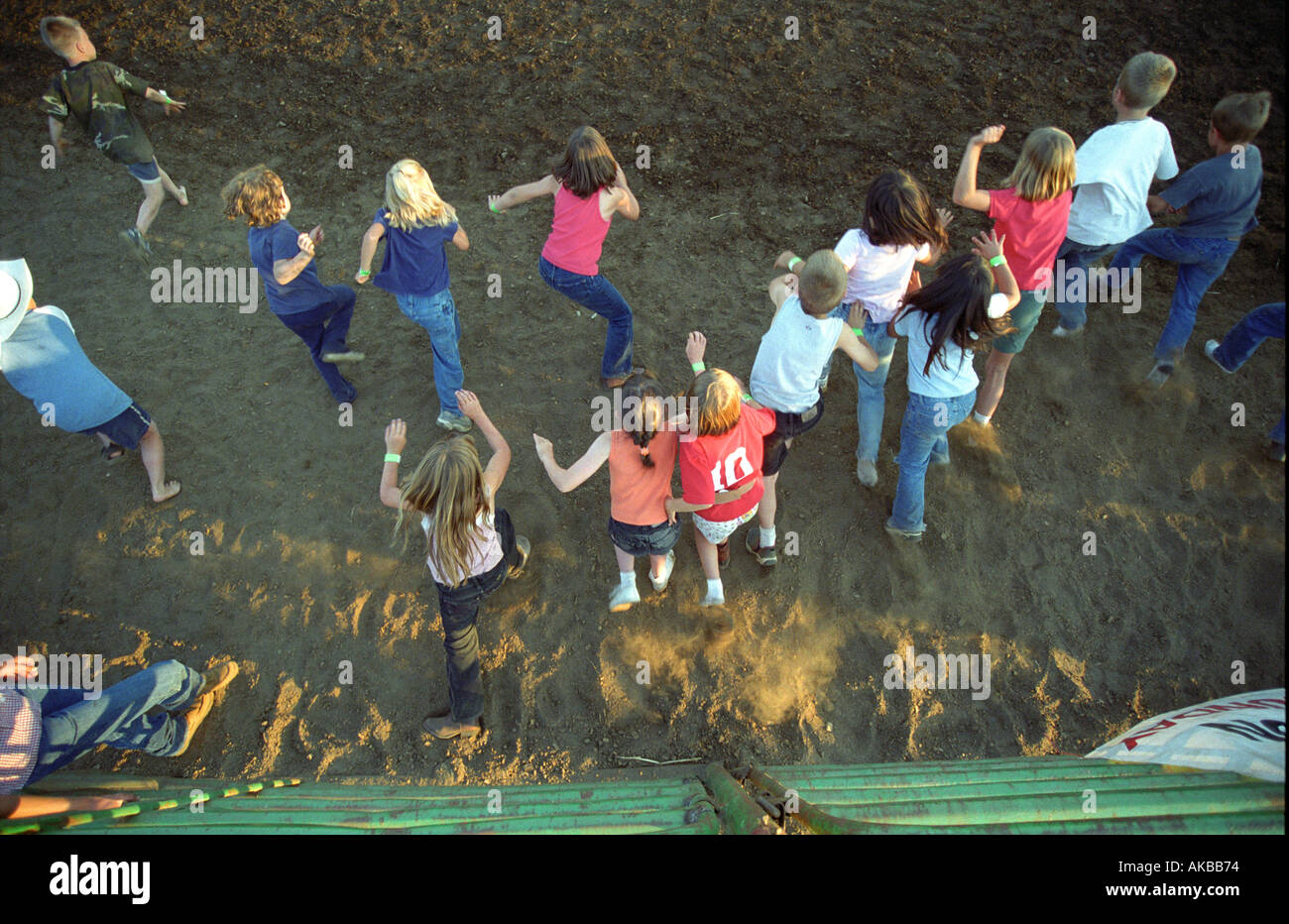 Children running at county fair Stock Photo