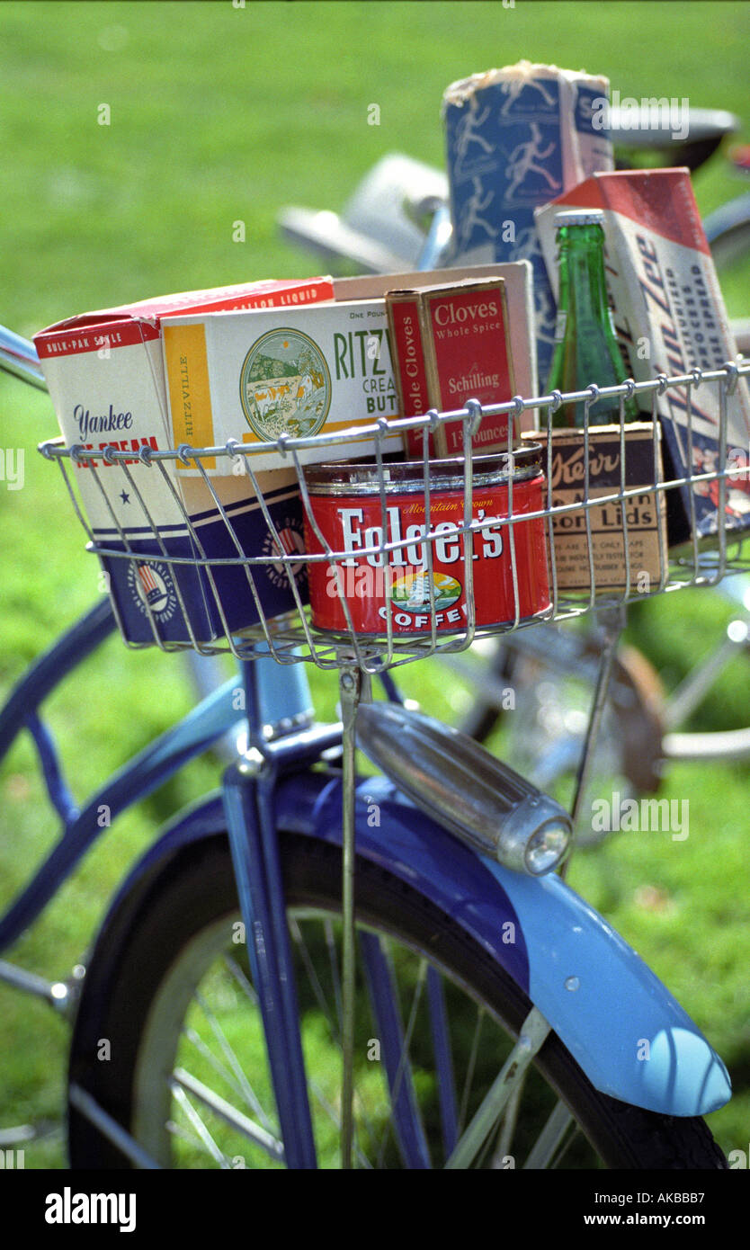 Vintage bicycle with antique grocery packaging in basket Stock Photo