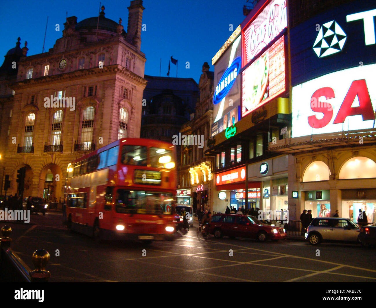 Piccadilly Circus London General Night View with Advertising signs Red Bus and Traffic January 03 Stock Photo