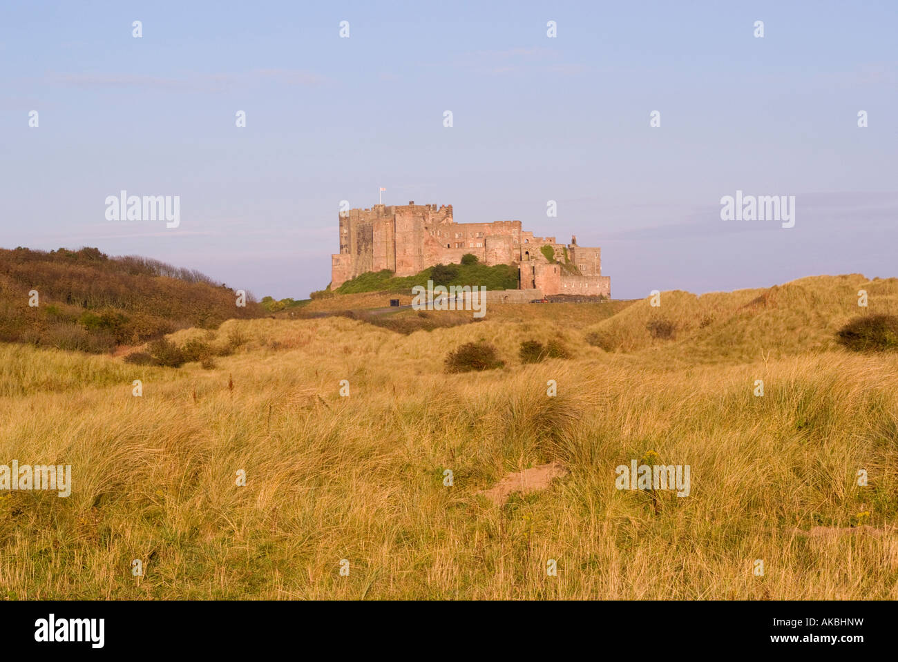 Early Morning Sunshine Lights Up Bamburgh Castle and Sand Dunes ...