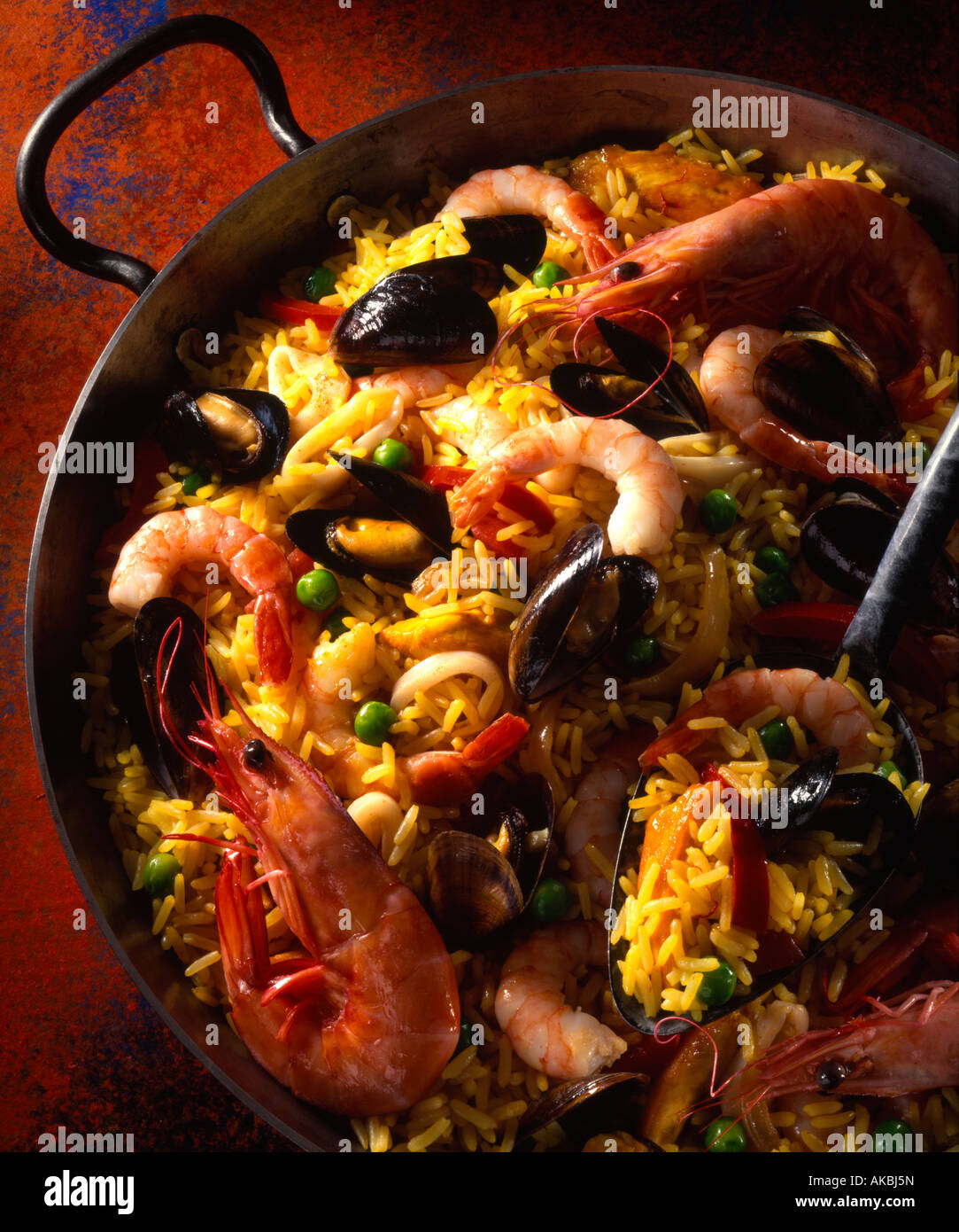 Calamari mussels king prawns arborio rice paella hires stock
