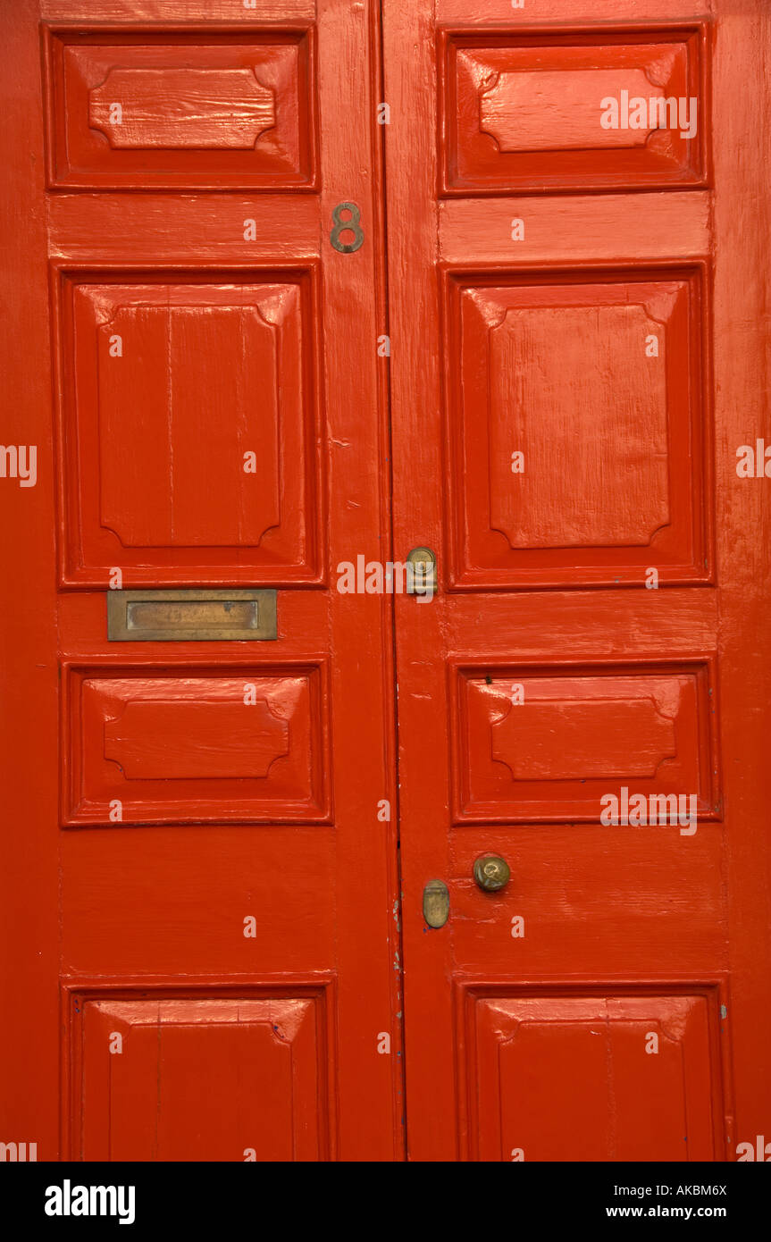 Red painted door in Laura Place Aberystwyth , a street of Georgian era town houses built in the 1830 s Stock Photo