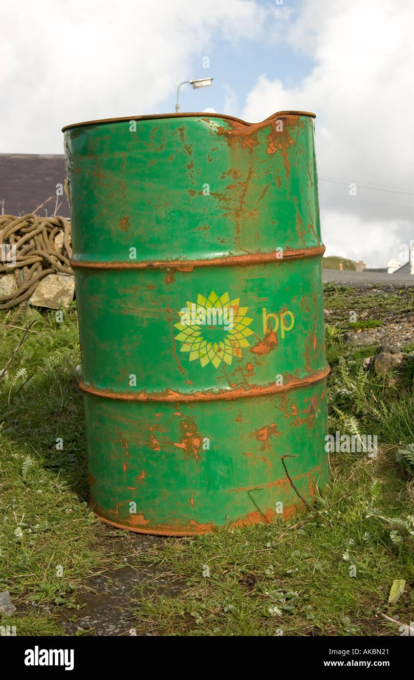 Rusty BP oil barrel abandoned in a field Stock Photo