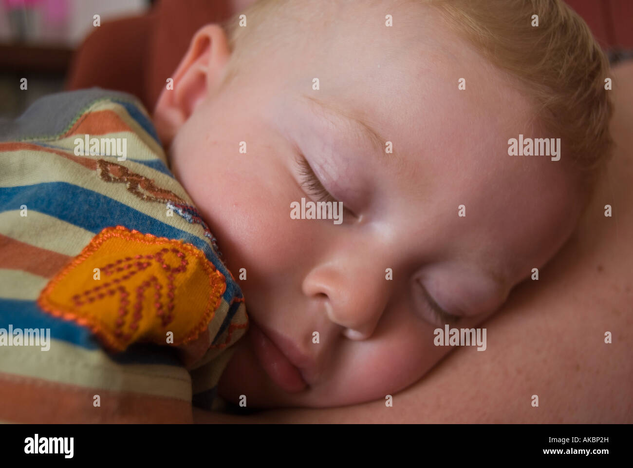 Baby Boy Asleep on Mother Stock Photo