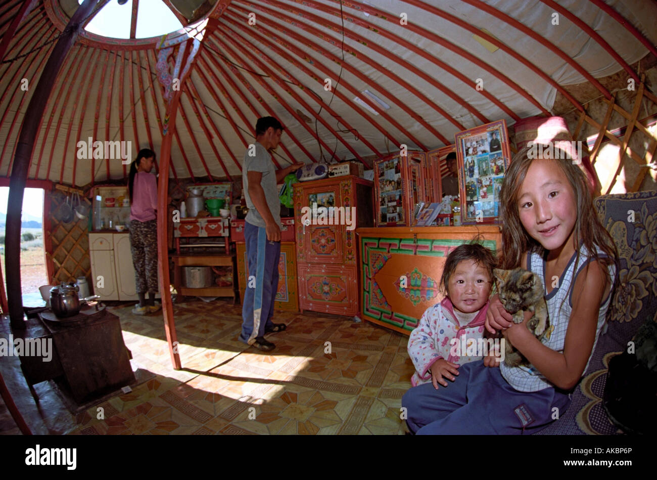 Family inside Mongolian traditional dwelling yurt. Bayankhongor aimag, Mongolia Stock Photo