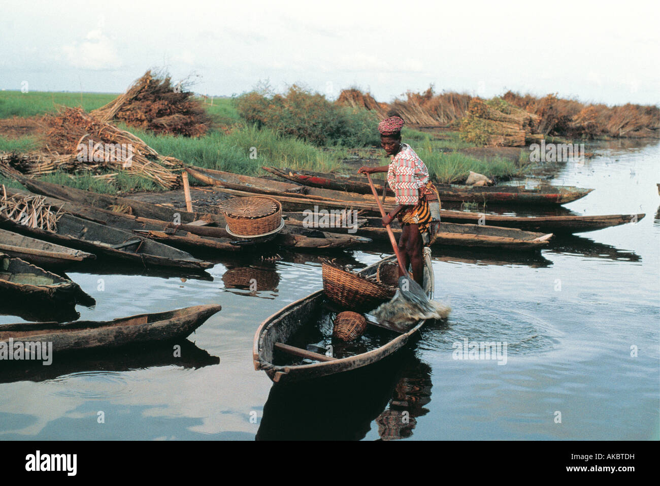 Pole boats on coast of Benin West Africa Stock Photo