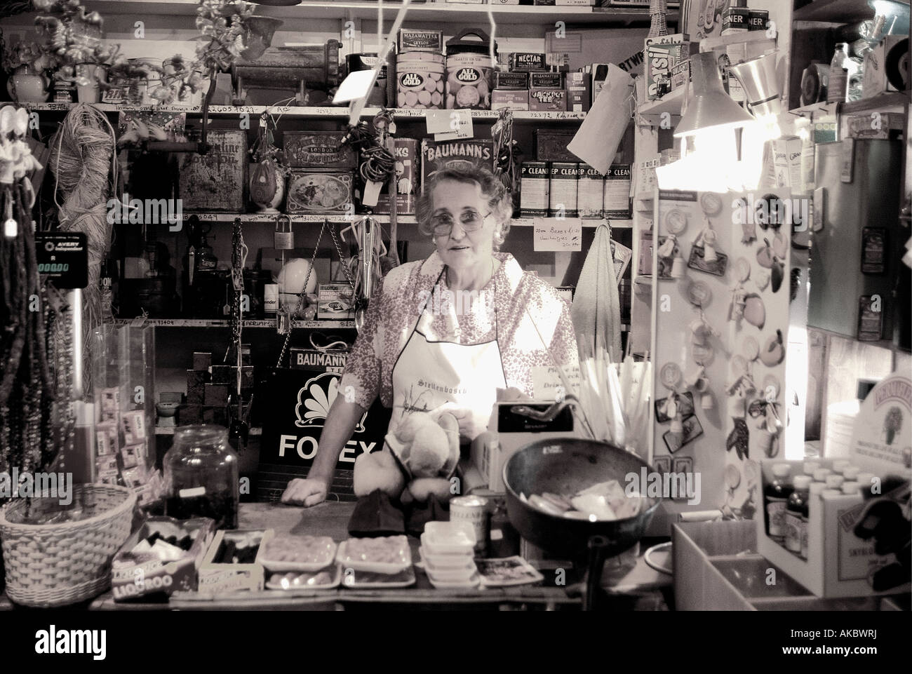 White lady at the counter of Oom Same se Winkel old fashioned general store in Stellenbosch West Cape South Africa Stock Photo