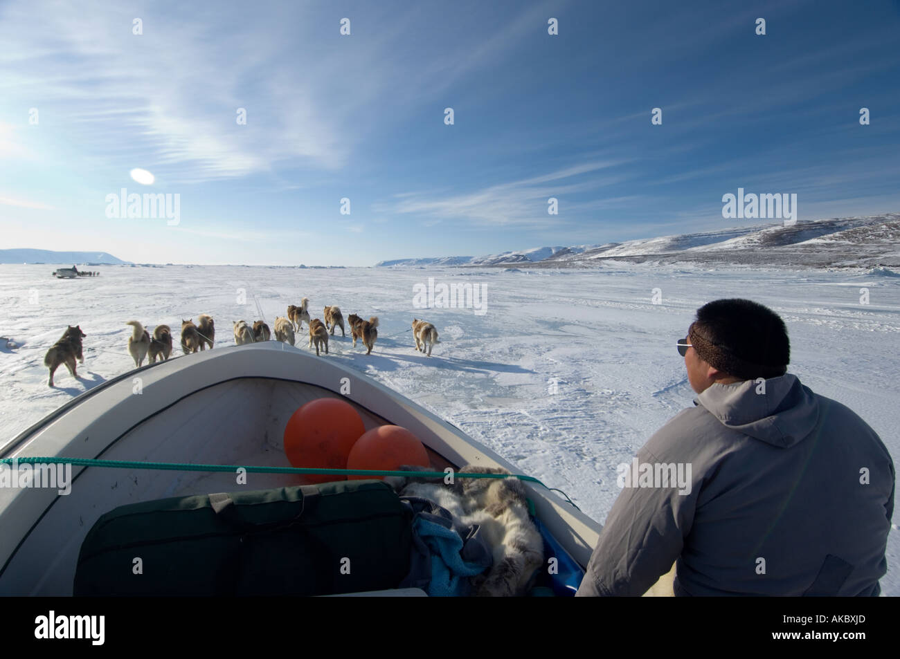 Qaanaaq Greenland  Gideon In spring Inuit hunters travel with a boat on sleds to launch when they reach the floe edge Stock Photo