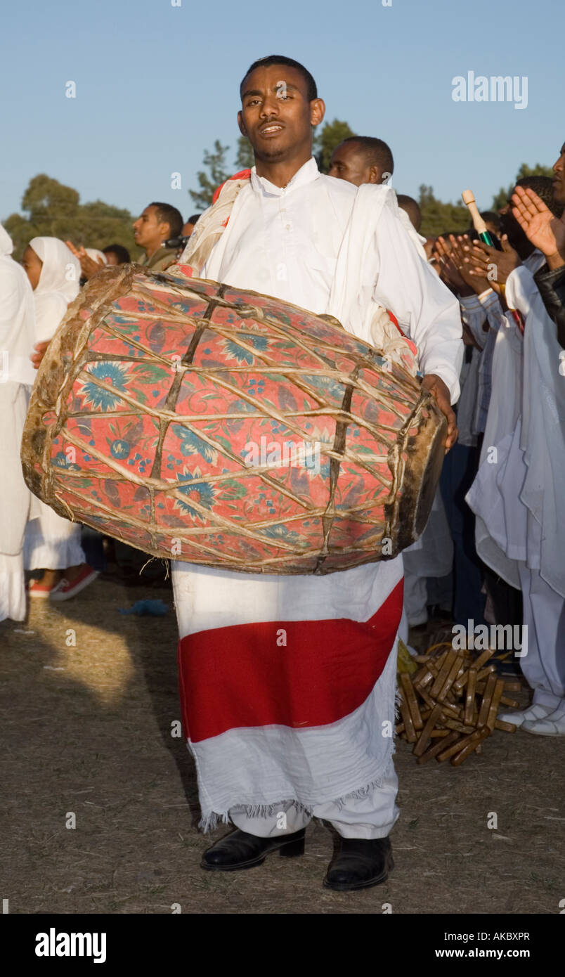 Ethiopian Orthodox Debterra (a choir member) with a traditional drum at the feast of Timkat