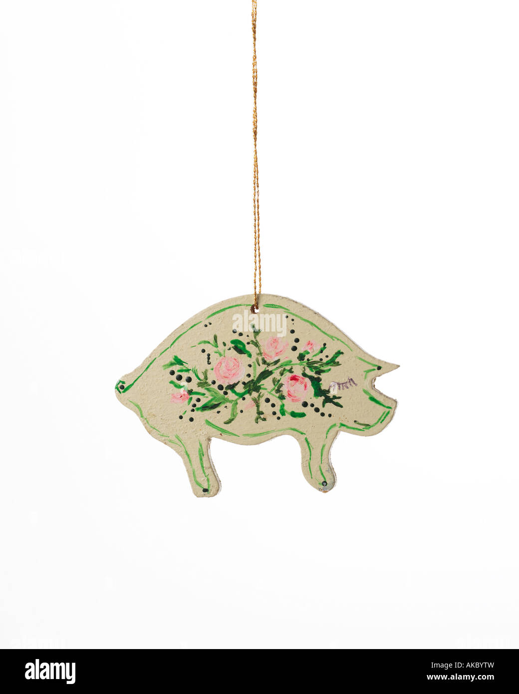 vintage Christmas ornament  decoration of pig with hand-painted flowers on its back and hanging from gold thread Stock Photo