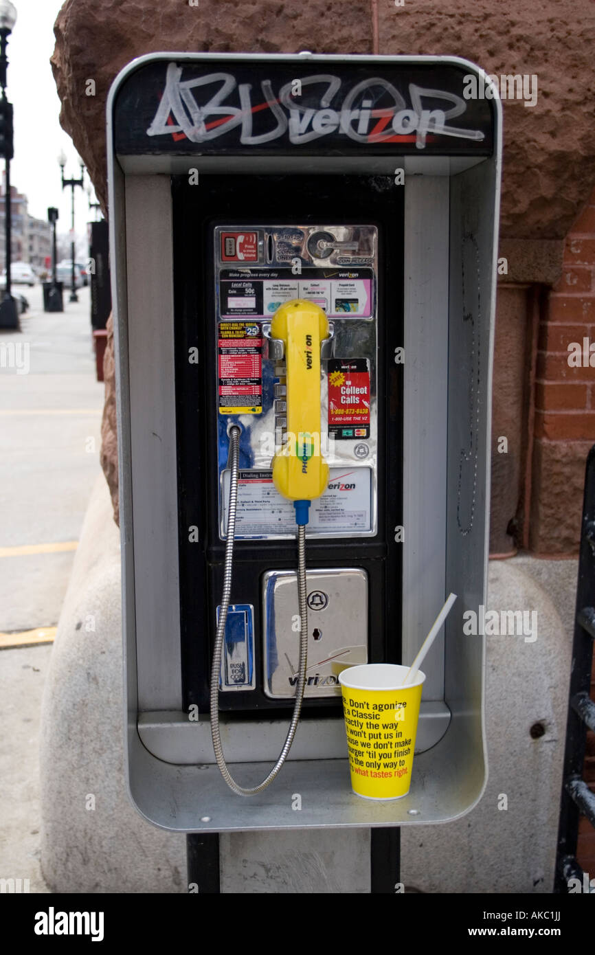 Telephone kiosk with graffiti and paper cup on Boston street Stock ...
