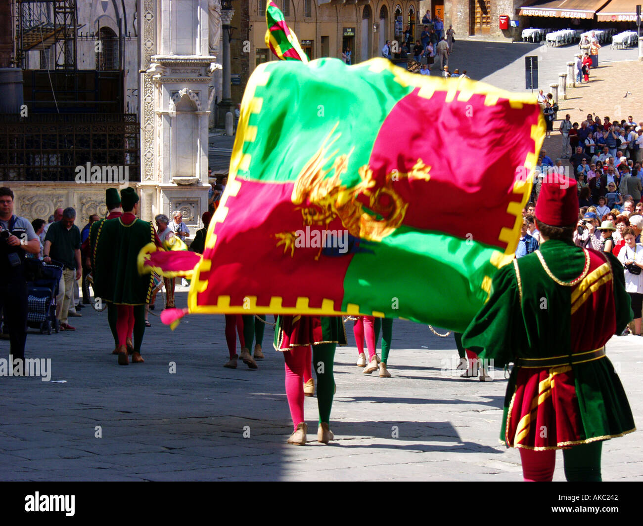 Flag twirlers from the dragon contrade in Siena Italy practice on a Sunday morning Stock Photo