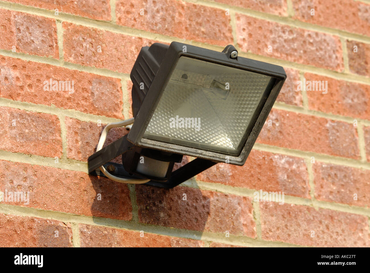 Security light mounted on the wall of a house Stock Photo Alamy