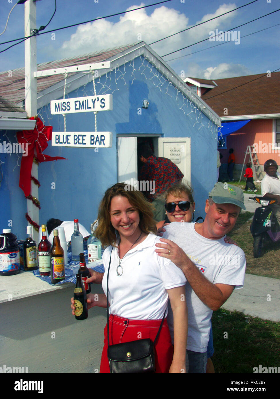 Tourists buy drinks before the annual New Year s Junkanoo parade in Green Turtle Cay the Abacos Bahamas Stock Photo