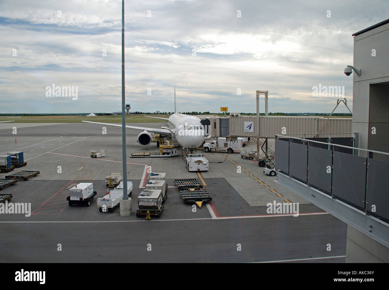 air canada jet at departure gate of ottawa airport with ground support