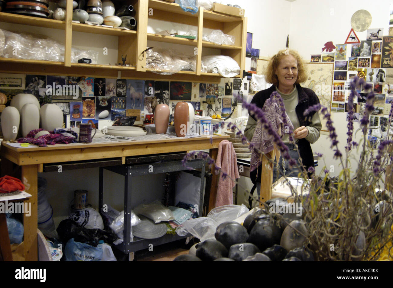 Potter showing work in studio Stock Photo