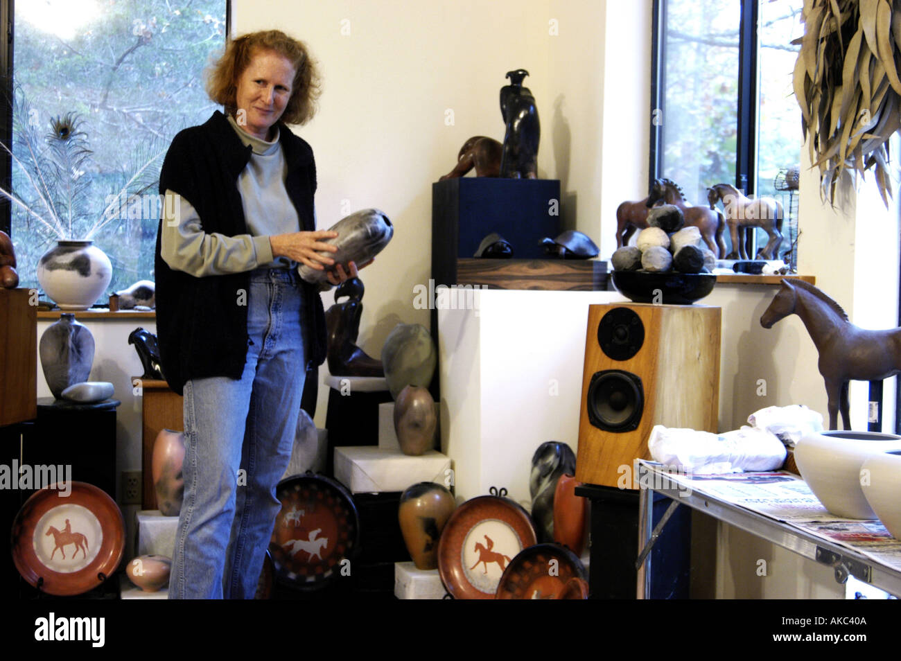 Potter showing work in studio Stock Photo