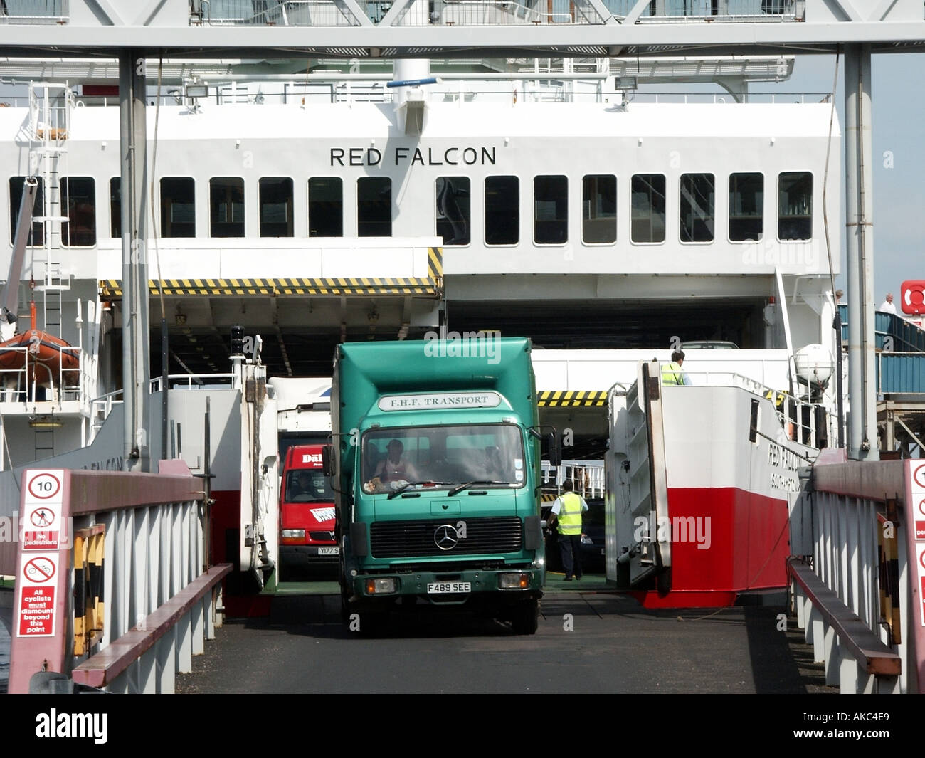 Close up travel on Red Funnel Red Falcon ferry boat docked at East Cowes Isle of Wight lorry truck vehicles & driver disembarking England UK Stock Photo