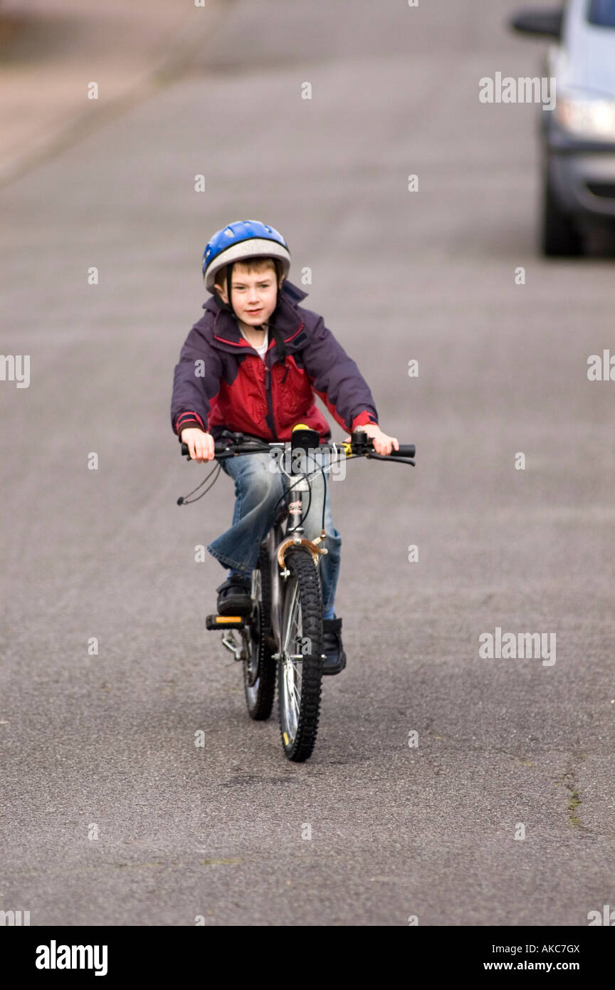 Eight Year Old Boy Riding Bike On Road Stock Photo Alamy