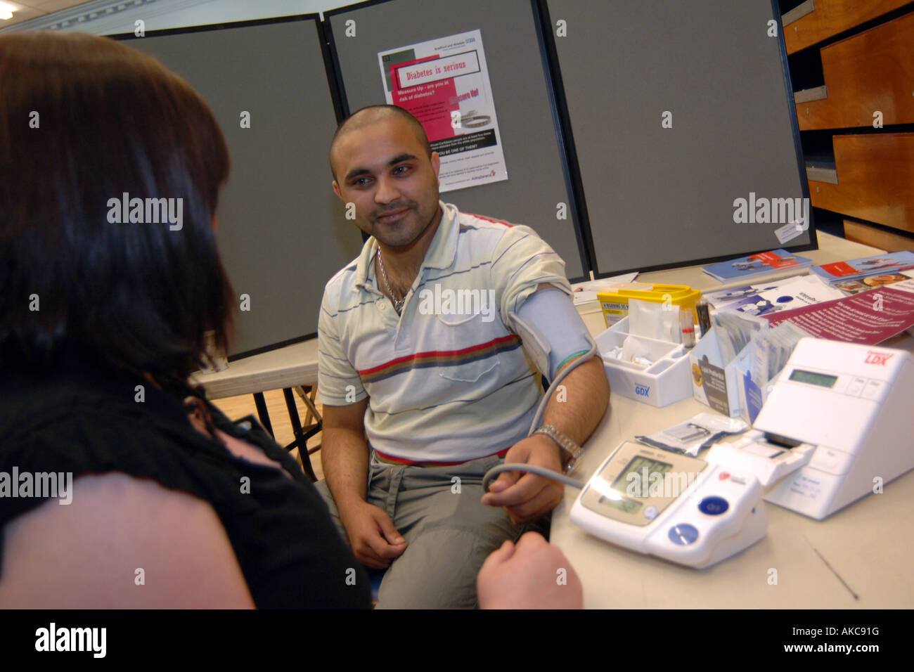 Members of the public attend a free health check to screen for diabetes Keighley, West Yorkshire. Stock Photo