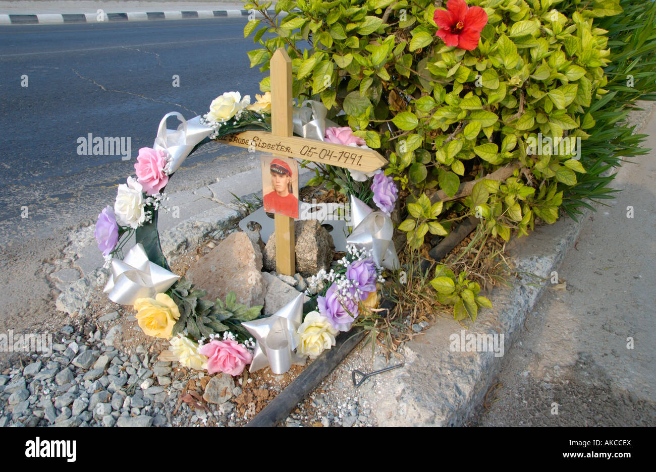 Roadside memorial wreath and cross with photo at Ayia Napa on the ...