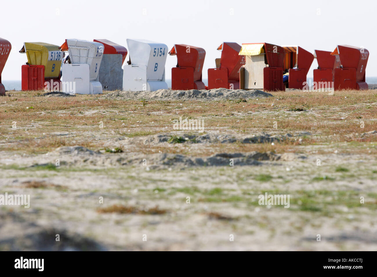 Roofed wicker beach chairs stand in Buesum near North Sea, Schleswig