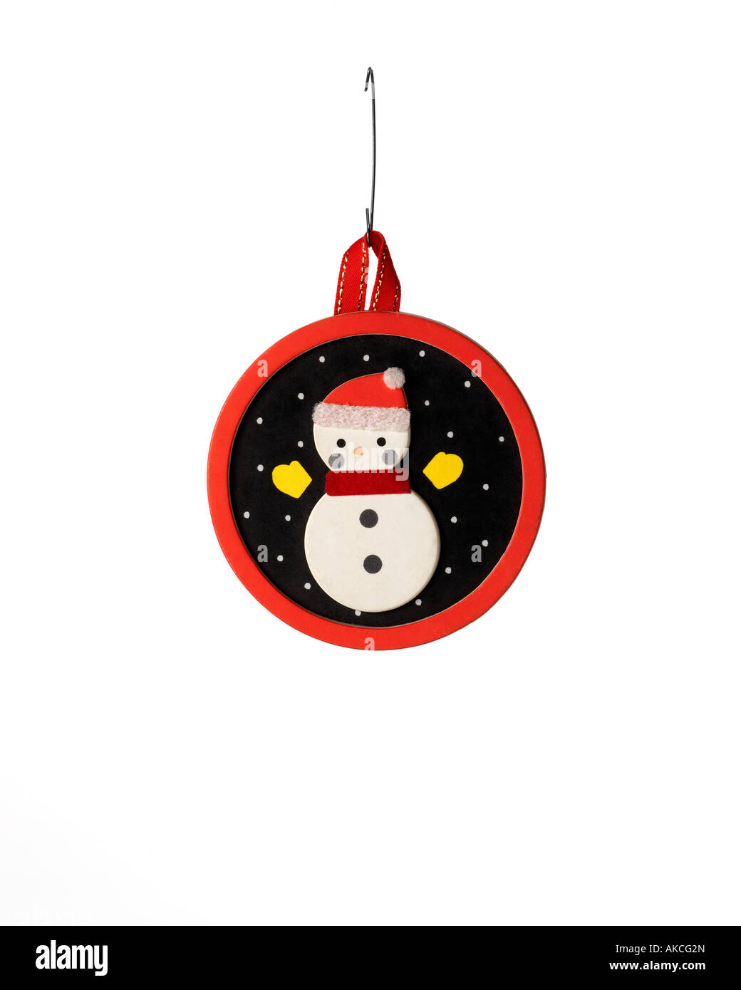 Vintage Christmas ornament decoration of handmade snowman night scene hanging on hook Stock Photo