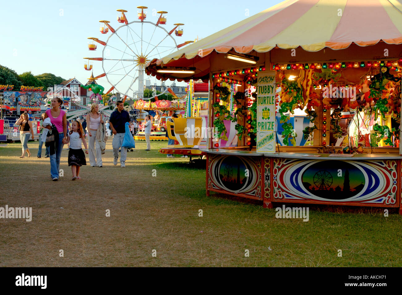 Family enjoying a day out at the fair Stock Photo Alamy