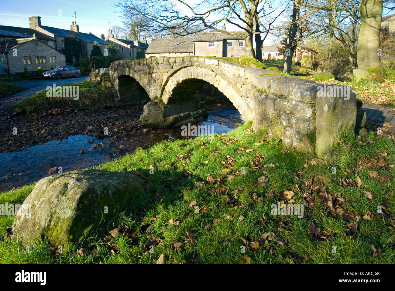 Ancient arched footbridge in the village of Wycoller, near Colne, Lancashire, UK Stock Photo