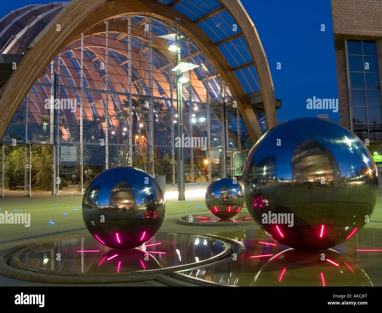 The Winter Garden and Millenium Square at dusk, with spheres that form part of the sculpture 'Rain' Sheffield City Centre UK Stock Photo