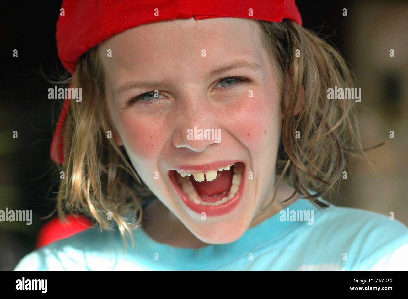 young girl laughing, joking and looking cheeky and playful Stock Photo