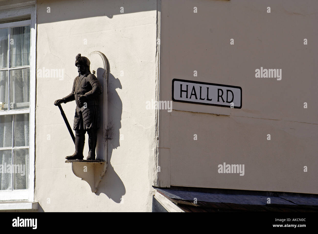 Statue on the facade of a house on the corner of Hig Street and Hall