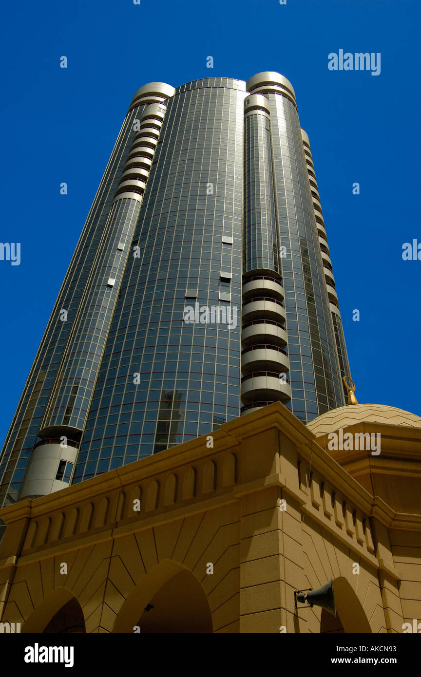 Mosque and modern high rise building in Abu Dhabi UAE Stock Photo - Alamy