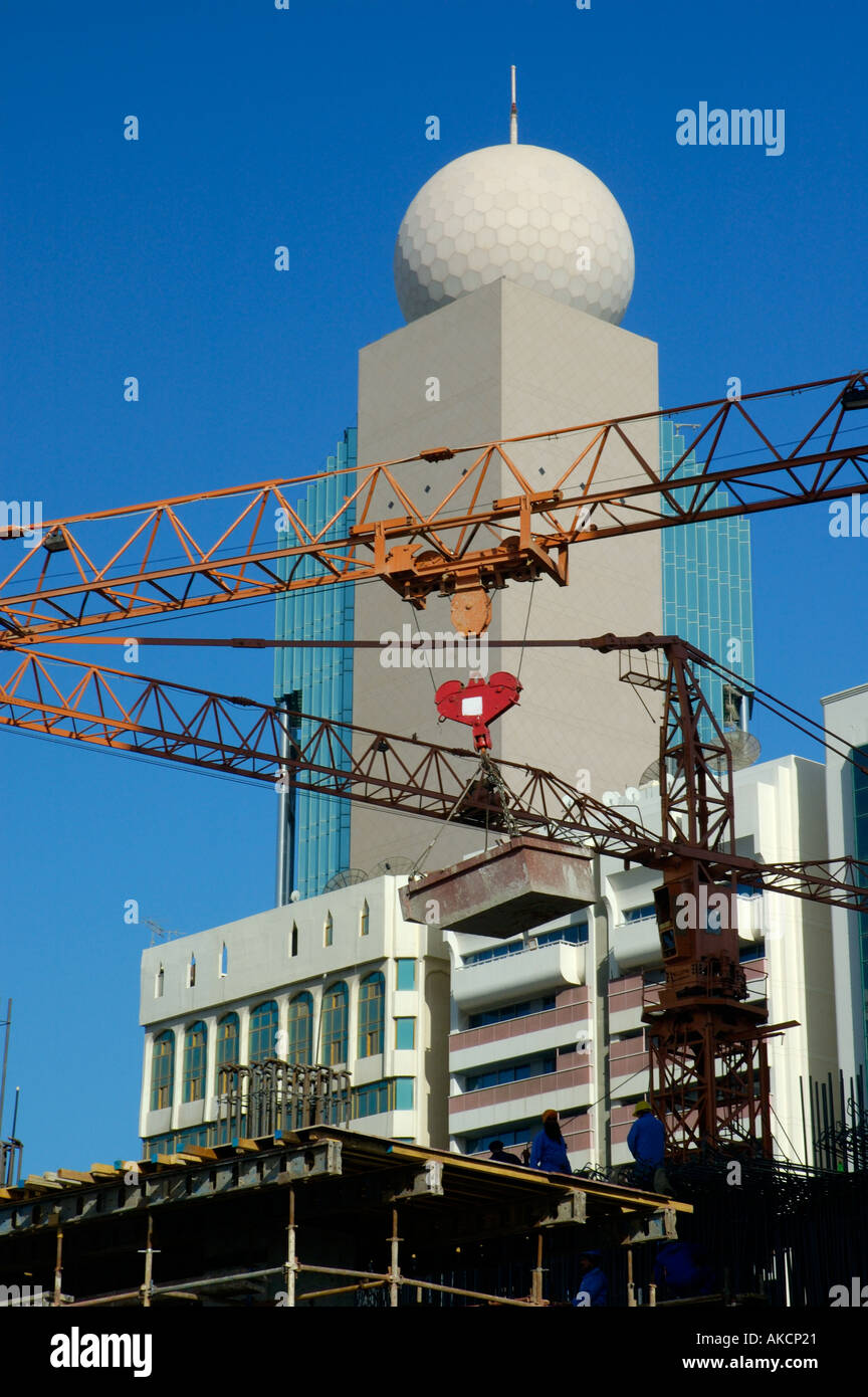 Construction site and Etisalat telecommunications building in downtown Abu Dhabi UAE Stock Photo