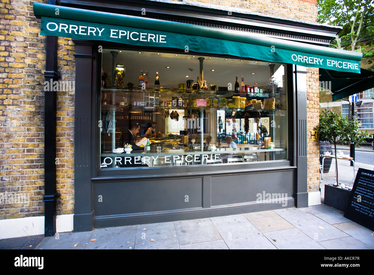 A businessman taking lunch at The Orrery Epicerie: a delicatessen in Marlybone, part of the Conran chain. London, England. Stock Photo