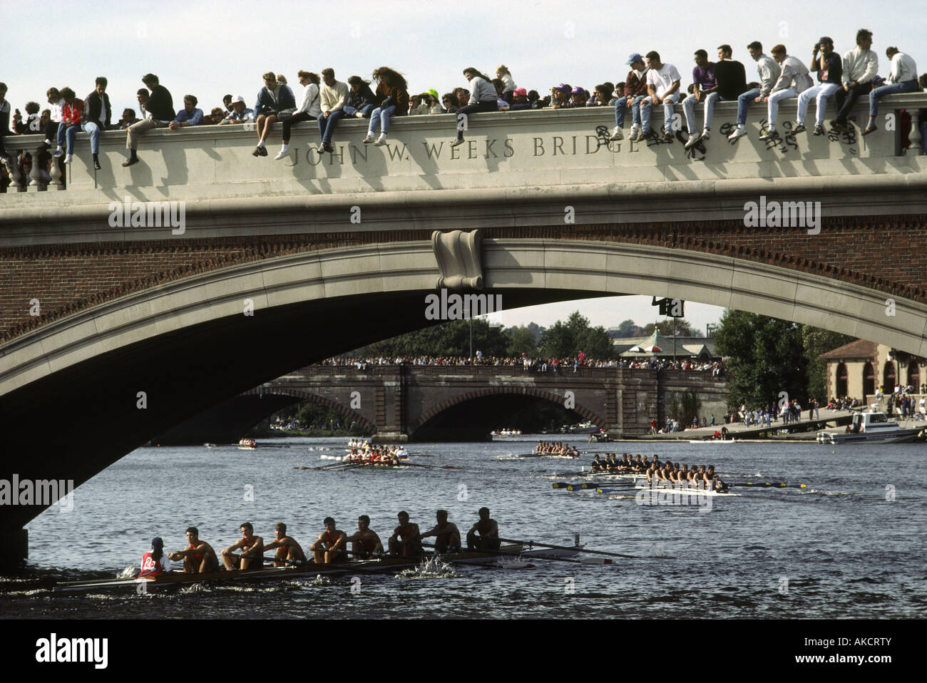 Spectators line a bridge over the Charles River to watch the Head of