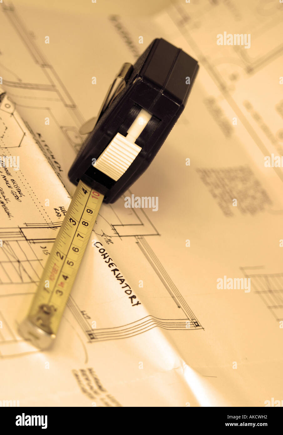 A Stock Photograph of a tape measure on architectural blueprints Stock