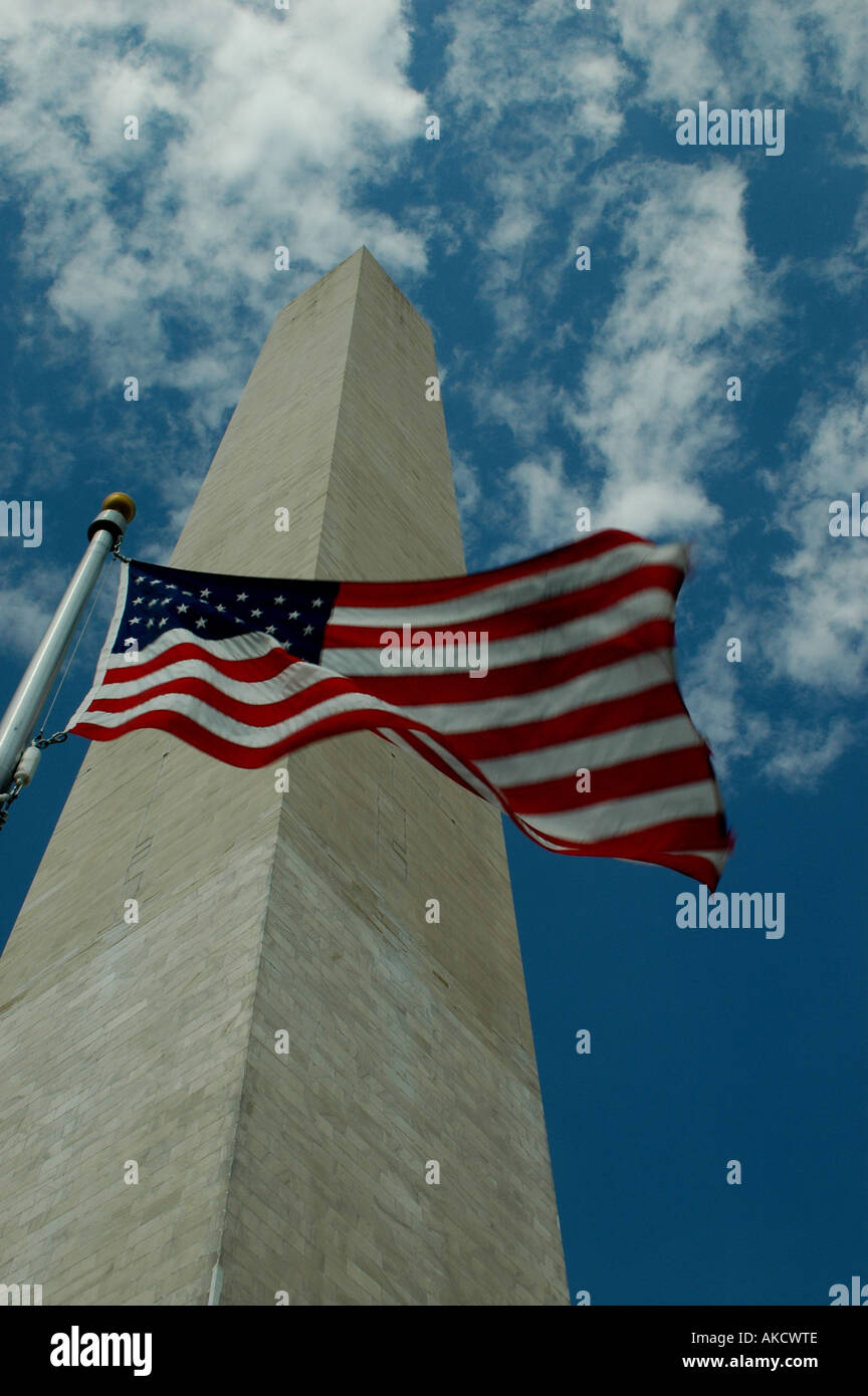 WASHINGTON DC AMERICAN FLAG FLIES IN FRONT OF THE TOWERING WASHINGTON ...