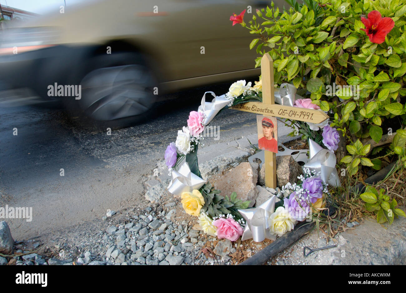 Roadside memorial wreath and cross with photo on the Mediterranean ...